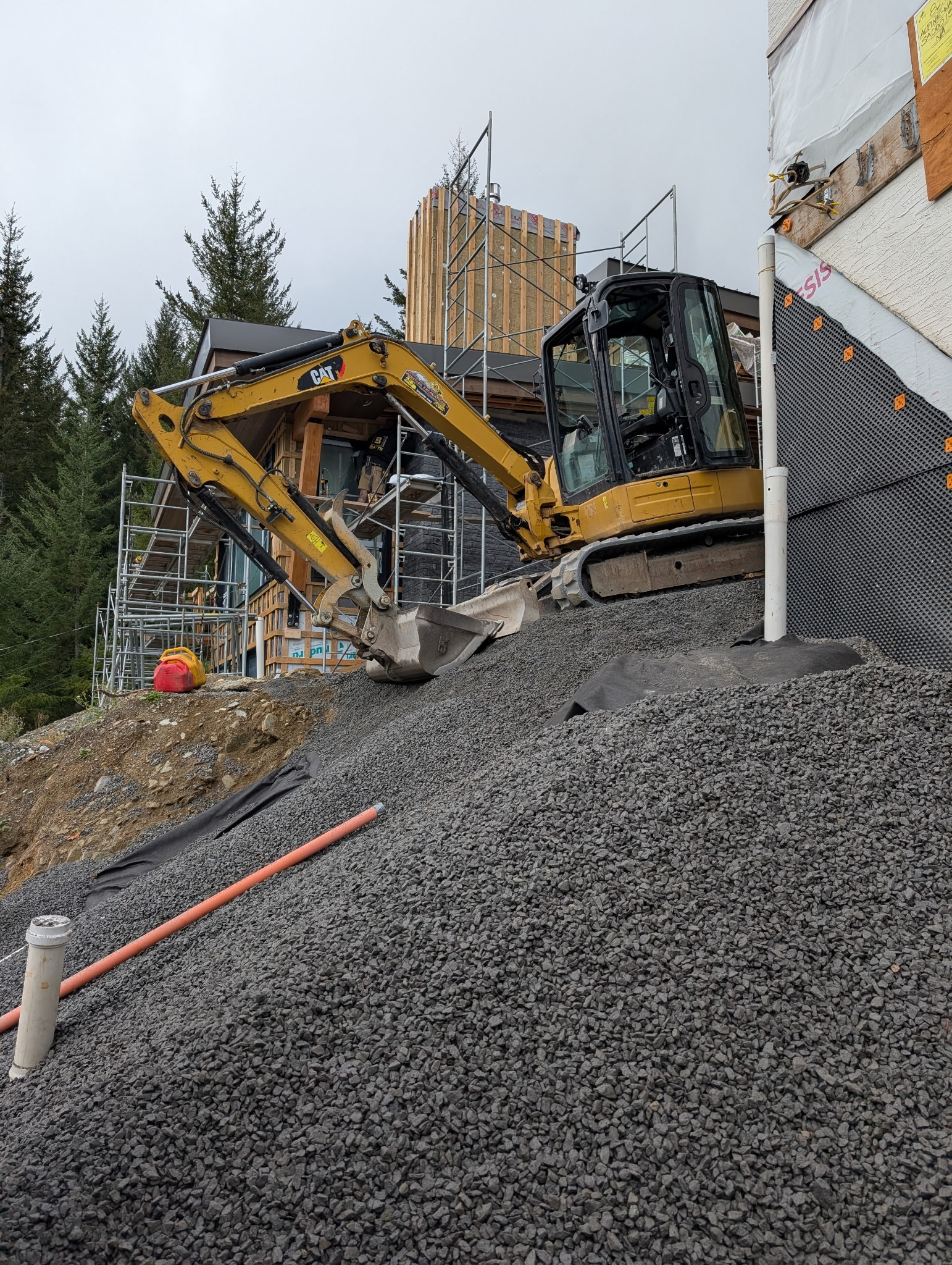 CAT excavator residential drainage gravel install Whistler